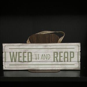 Wooden Sign with 'Weed It and Reap' Text